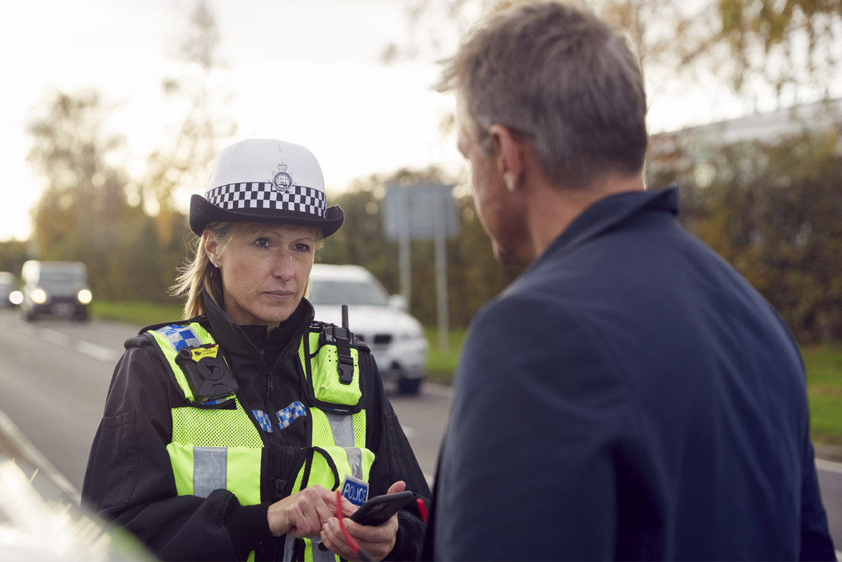 getting past the gatekeeper in B2B telemarketing highlighted by traffic officer stopping businessman