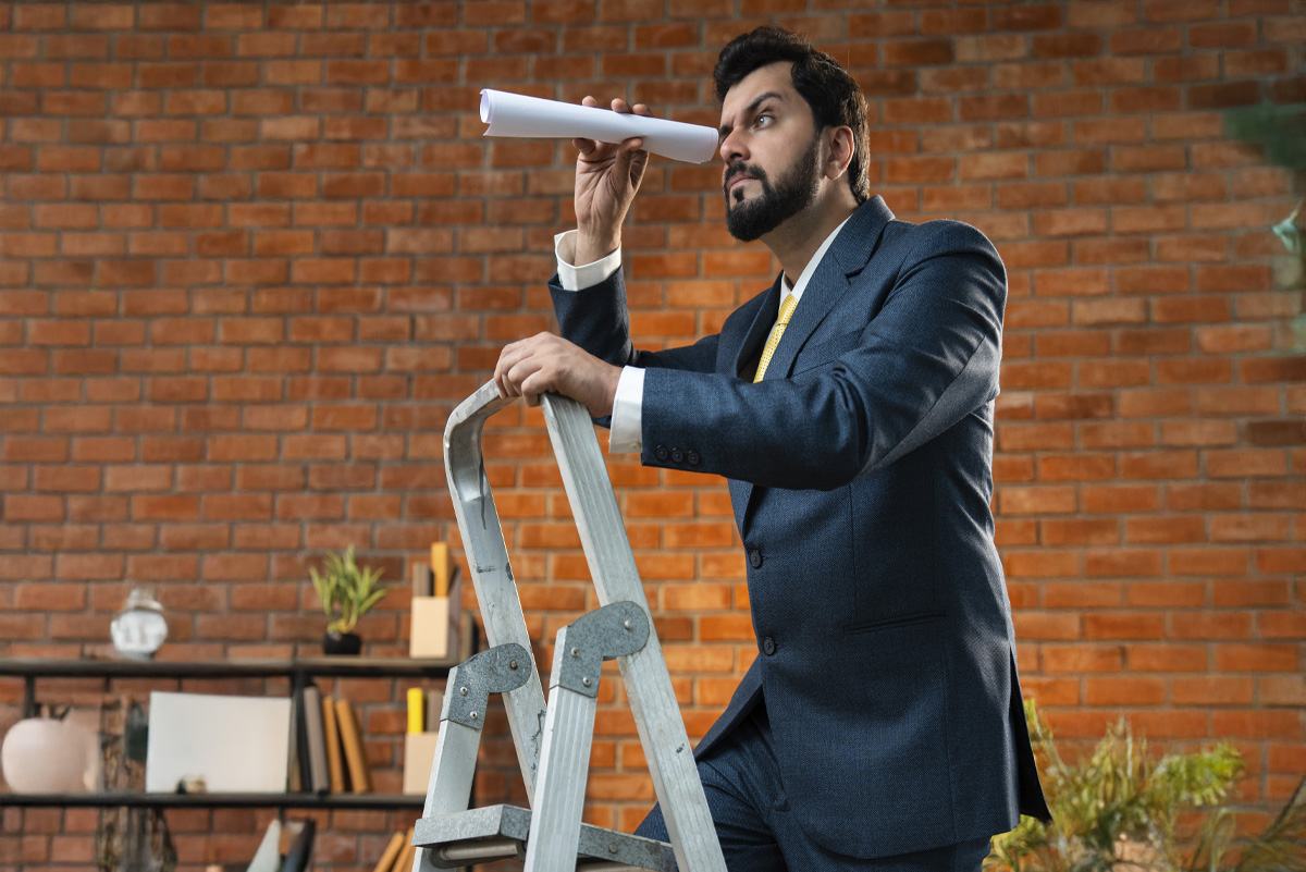 business man standing on ladder to display B2B relationship ladder