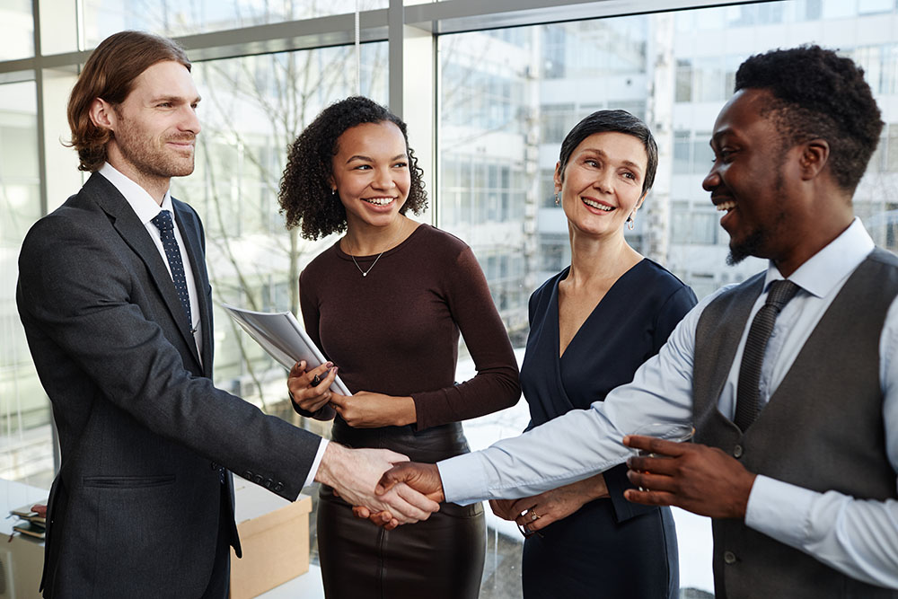 b2b market leadership not just selling as shown by business people making deal